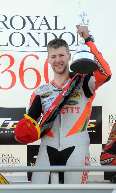 Ian Hutchinson celebrates victory in the Royal London 360 Superstock TT